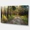 Designart - Road Through Green Pine Forest - Landscape Photography Canvas Print